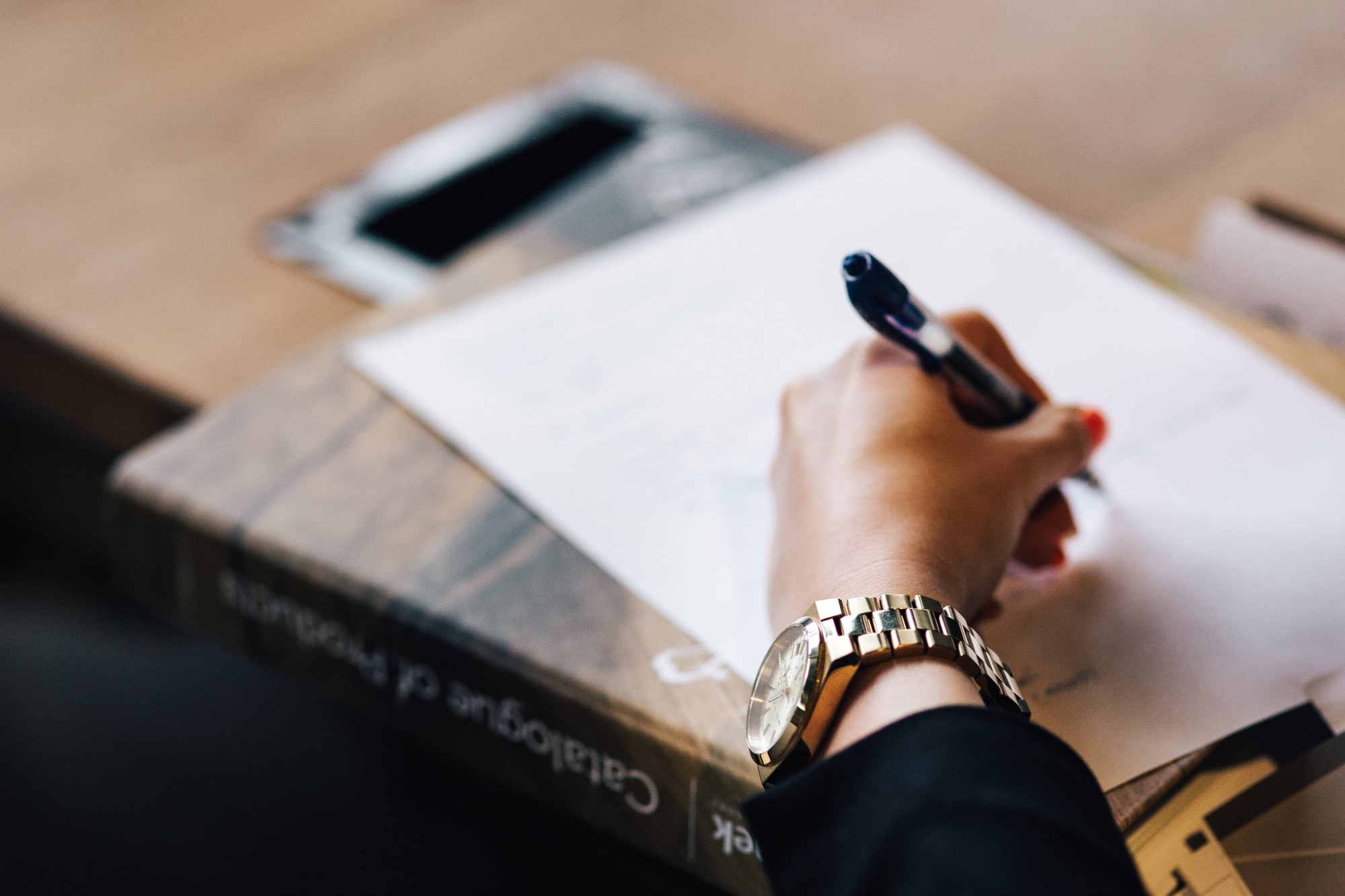 Notion AI Meeting Notes: A short introduction 1 kaboompics woman taking notes 4017