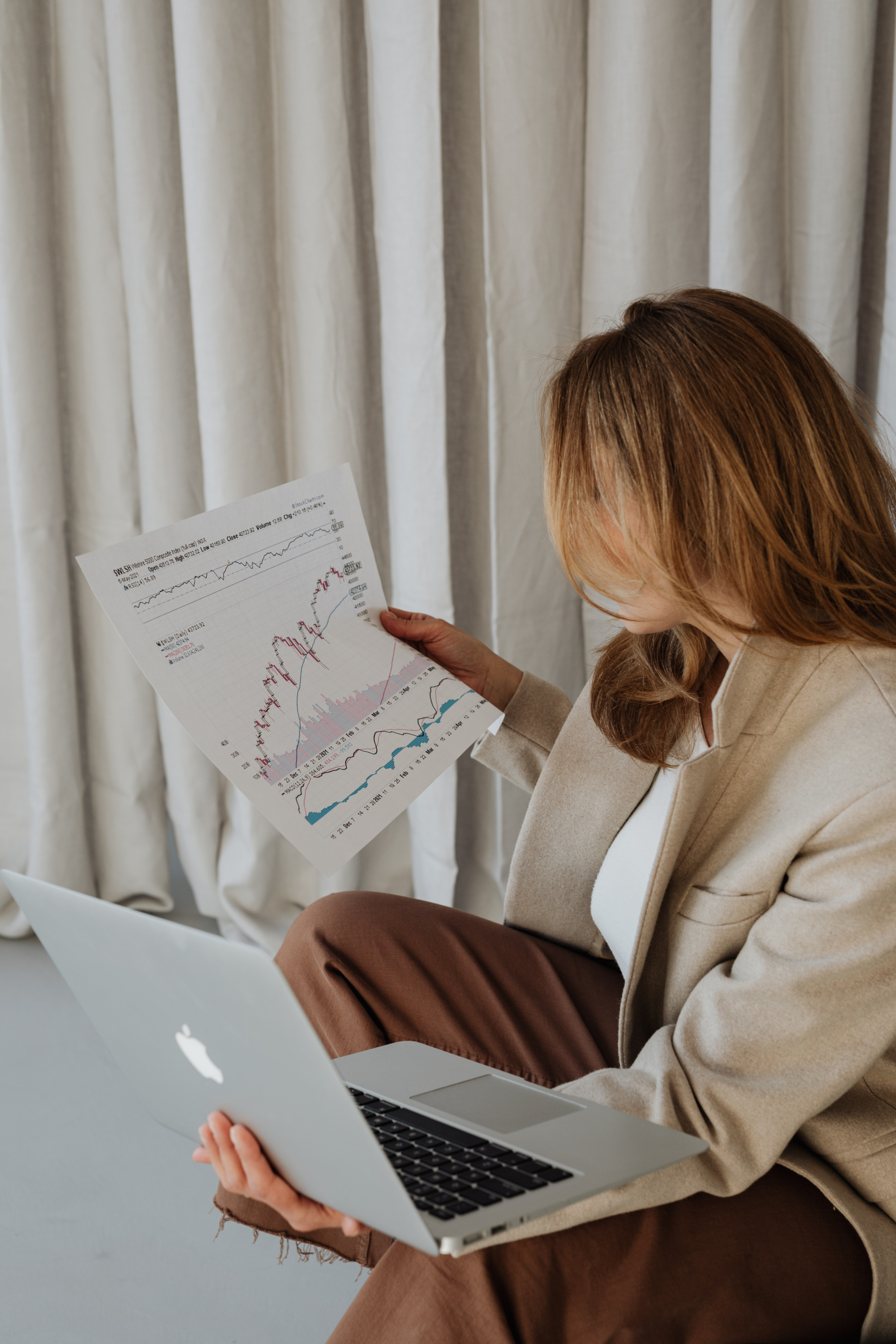 Why our Sales Dashboard Power BI template works for any business 1 kaboompics businesswoman studies charts currency exchange rate stock market bitcoin exchange rate 25725